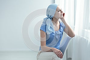 Cancer survivor sitting on chair