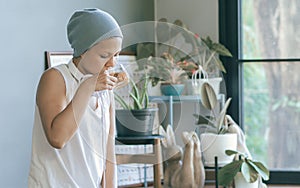 Cancer woman is drinking tea