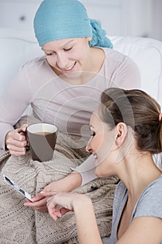 Cancer woman watching family pictures