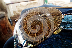 Cancun beach reflection of the hut roof from sunglasses