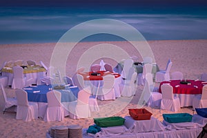 Cancun caribbean beach, chairs and tables at evening, Riviera Maya, Mexico