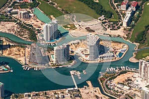 Aerial photograph of the residential apartments on the water in Cancun, Shark Tower, Aria Puerto, and the Marea residences photo