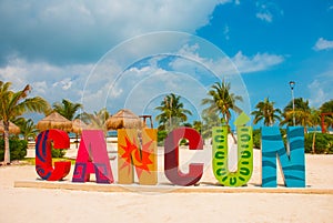 Cancun, Mexico, inscription in front of the Playa Delfines beach. Huge letters of the city name. photo