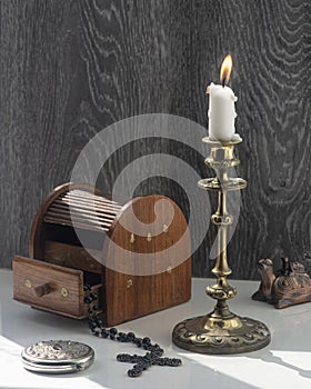 Candelabra with candle, inlaid jewelry box, women`s mirror.