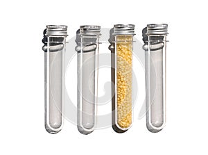 Candelilla Wax in PET preform bottle with aluminium cap. Cosmetic chemicals ingredient on laboratory table