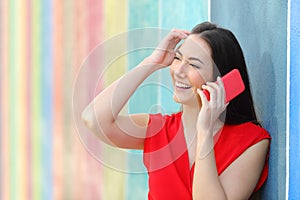 Candid fashion woman in red talking on phone photo