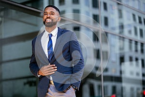 Candid lifestyle photo of a handsome african american businessman in a suit, attractive, multiethnic, mixed ethnicity model