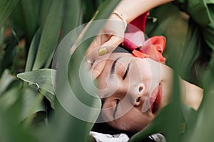 Candid lifestyle Portrait of happy young beautiful asian sexy woman enjoying life outdoor in park at spring. Smiling