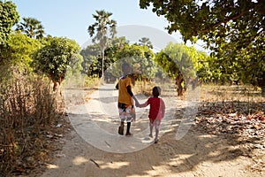 Candid picture of African children enjoying their life outdoors in an African village near Bamako, Mali