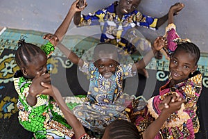 Candid Picture of Black African Children Playing and having fun together photo