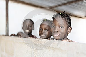 Candid Portrait of Three Gorgeous African Children Smiling, Laughing and Enjoying Photos