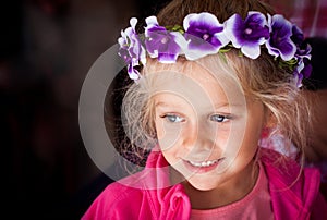 Candid real people shot of girl with flowers in her hair