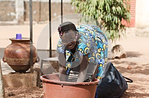 Candid Shot of African Black Ethnicity Girl Child Labour photo