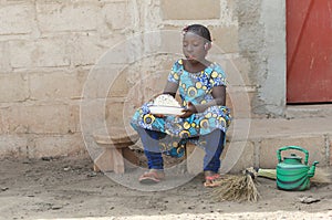 Candid Shot of African Black Girl Cooking Rice Outdoors