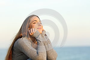 Candid woman breathing fresh air relaxing on the beach