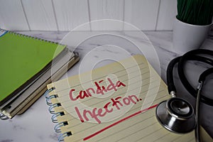 Candida Infection write on a book and keyword isolated on Office Desk. Healthcare/Medical Concept