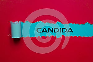 Candida Text written in torn paper. Medical concept