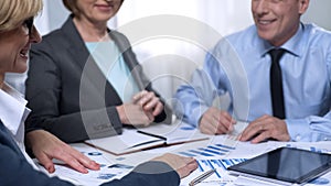 Candidate getting acquainted with campaign office workers, handshaking, deal