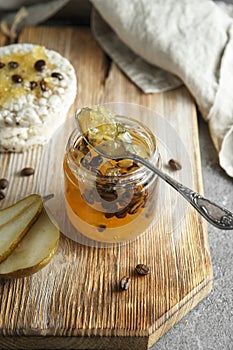 Candied fruit jelly. pear marmalade with coffee beans. Jar of pear jam