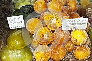 Candied fruits in a shop window. Delicacy.