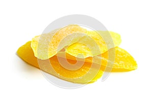 Candied mango fruit chips isolated on white background. Dry dehydrated mango slices