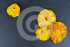 Candied pinapple rings , aka crystallized fruit on black background