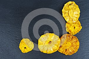 Candied pinapple rings , aka crystallized fruit on black background