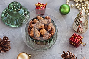 Candied or sugared almond in glass jar on Christmas background