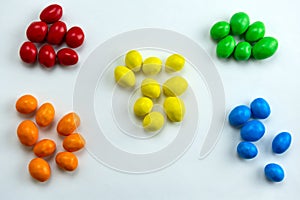 Candies arranged in a handful by colors