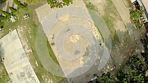 CANDIJAY, BOHOL, PHILIPPINES - NOVEMBER 20, 2015: Filipina kids play basketball. Anda City. Aerial views.