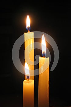 Candle against dark background