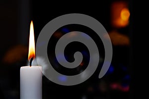 Candle burning in the dark