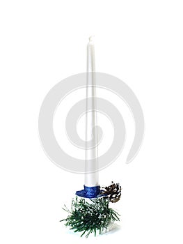 Candle on a candlestick and pine cone isolated