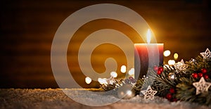 Candle and Christmas decoration with wooden background