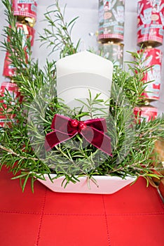 Candle display in a ceramic pot + fern for Christmas