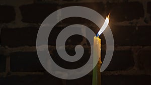 Candle flame close-up on a dark background. Melted Wax Candle light border design. Long Exposure. Darkness.