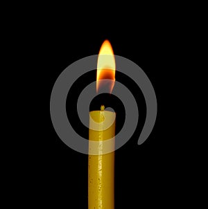 Candle flame closeup isolated on black background