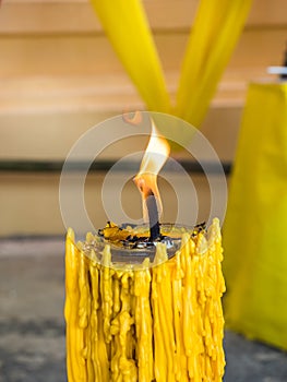 Candle Flame and yellow candle drippings