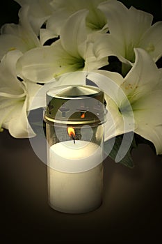 Candle and flowers for condolences