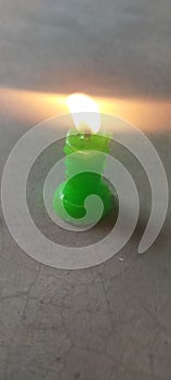 Candle green wax, design of fire,light zeal photo