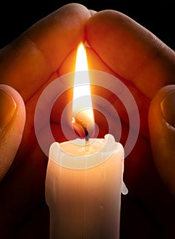 Candle in hands