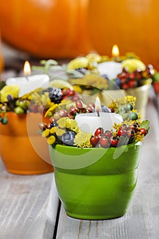 Candle holder decorated with autumn flowers