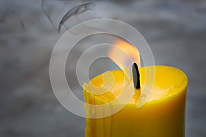 A candle is an ignitable wick embedded in wax, or another flammable solid substance