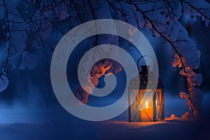 Candle lantern in the snow