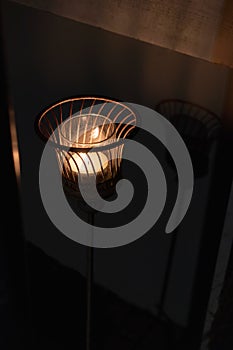 Candle light in basket with shadow