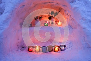 Candle light in ice and snow on Christmas day