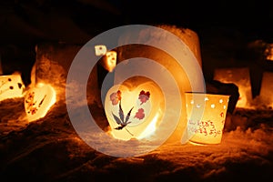 Candle light in ice and snow on Christmas day