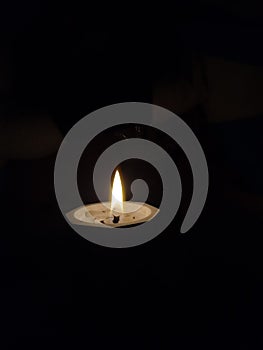 Candle Light in ithe middle darknes