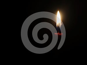 candle light shining in the darkness