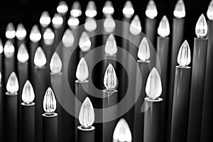 Candle lights burning in St. Peter\'s Basilica, Vatican, Rome, Italy. Black and white photo